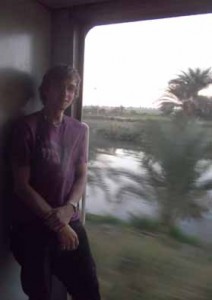 The train to Luxor and Nile running beside it - for much of its length the Nile is extremely narrow