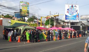 After the police action today, the hunger strike camp is condensed to the side of the road with a police line right next to it
